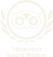 The TripAdvisor owl logo icon with a laurel wreath and the text "Tripadvisor Award Winner" underneath.